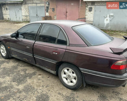 Красный Опель Омега, объемом двигателя 2.5 л и пробегом 390 тыс. км за 1800 $, фото 2 на Automoto.ua