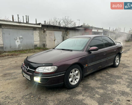 Красный Опель Омега, объемом двигателя 2.5 л и пробегом 390 тыс. км за 1800 $, фото 1 на Automoto.ua