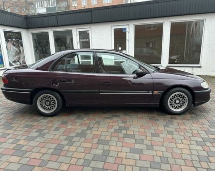 Червоний Опель Омега, об'ємом двигуна 2 л та пробігом 301 тис. км за 2200 $, фото 2 на Automoto.ua