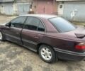 Красный Опель Омега, объемом двигателя 2.5 л и пробегом 390 тыс. км за 1800 $, фото 2 на Automoto.ua