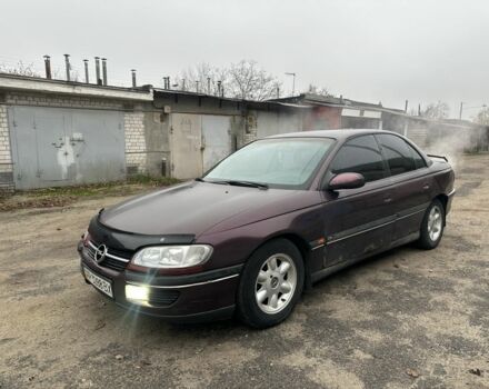 Красный Опель Омега, объемом двигателя 2.5 л и пробегом 390 тыс. км за 1800 $, фото 1 на Automoto.ua