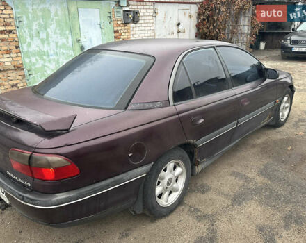 Красный Опель Омега, объемом двигателя 2.5 л и пробегом 390 тыс. км за 1800 $, фото 3 на Automoto.ua