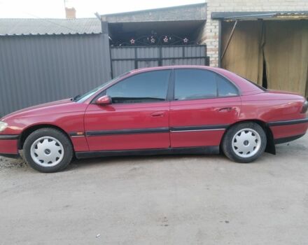 Красный Опель Омега, объемом двигателя 2 л и пробегом 250 тыс. км за 2400 $, фото 1 на Automoto.ua