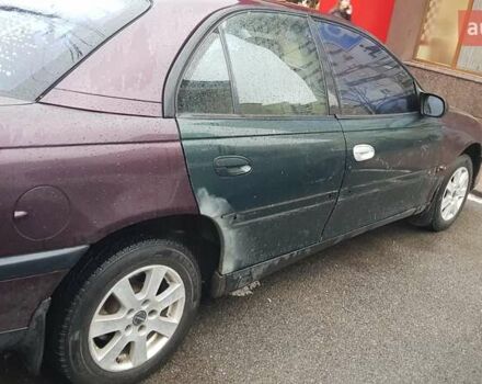 Красный Опель Омега, объемом двигателя 2 л и пробегом 300 тыс. км за 2700 $, фото 5 на Automoto.ua