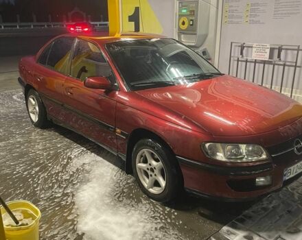 Опель Омега 1996 в Новомосковске на Automoto.ua Красный Опель Омега, объемом двигателя 2 л и пробегом 400 тыс. км за 1600 $, фото 1 на Automoto.ua