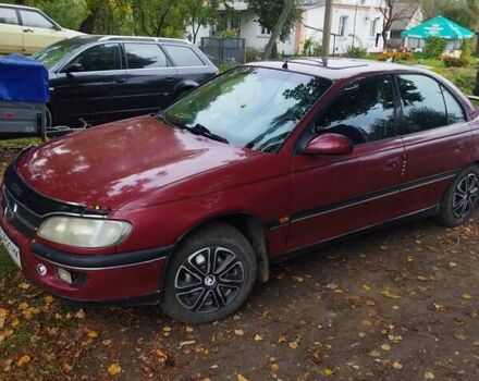 Червоний Опель Омега, об'ємом двигуна 2 л та пробігом 300 тис. км за 2200 $, фото 2 на Automoto.ua