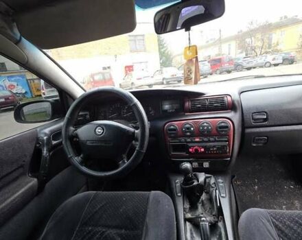 Червоний Опель Омега, об'ємом двигуна 2 л та пробігом 335 тис. км за 1750 $, фото 1 на Automoto.ua