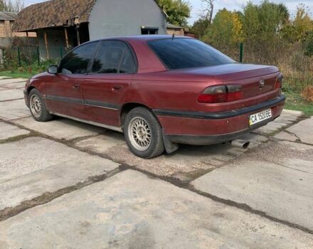 Червоний Опель Омега, об'ємом двигуна 2 л та пробігом 250 тис. км за 1500 $, фото 2 на Automoto.ua