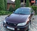 Красный Опель Омега, объемом двигателя 2.5 л и пробегом 281 тыс. км за 2000 $, фото 1 на Automoto.ua