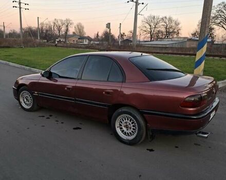 Красный Опель Омега, объемом двигателя 2 л и пробегом 400 тыс. км за 2390 $, фото 7 на Automoto.ua