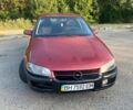 Красный Опель Омега, объемом двигателя 2.5 л и пробегом 428 тыс. км за 2400 $, фото 1 на Automoto.ua