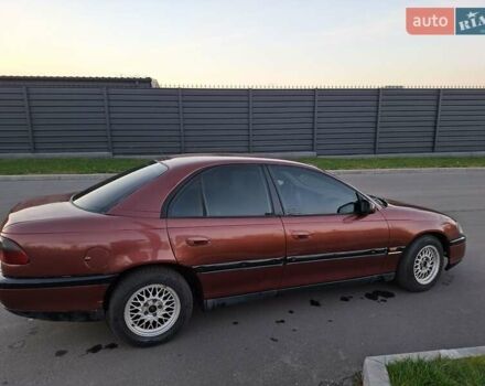 Красный Опель Омега, объемом двигателя 2 л и пробегом 400 тыс. км за 2390 $, фото 4 на Automoto.ua