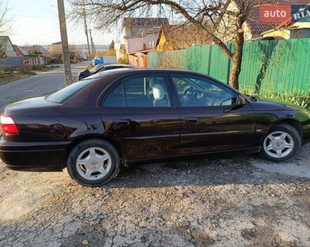 Красный Опель Омега, объемом двигателя 2.2 л и пробегом 222 тыс. км за 3500 $, фото 3 на Automoto.ua