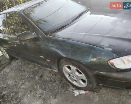 Красный Опель Омега, объемом двигателя 2.2 л и пробегом 401 тыс. км за 3500 $, фото 6 на Automoto.ua