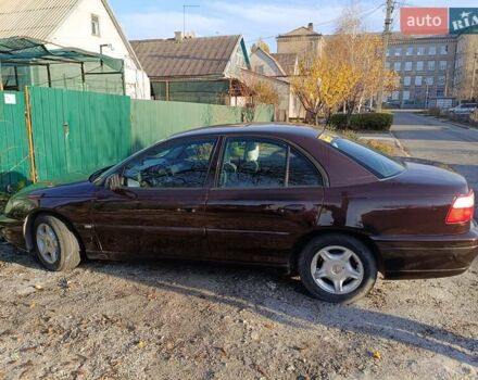 Красный Опель Омега, объемом двигателя 2.2 л и пробегом 222 тыс. км за 3500 $, фото 4 на Automoto.ua