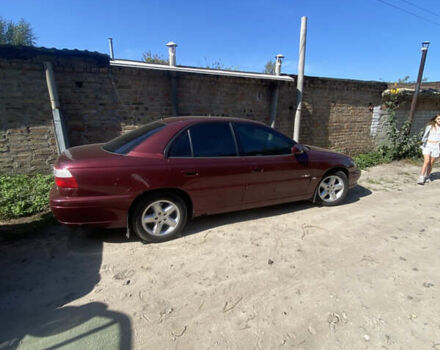 Красный Опель Омега, объемом двигателя 2.6 л и пробегом 330 тыс. км за 1700 $, фото 13 на Automoto.ua