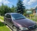 Красный Опель Омега, объемом двигателя 2.2 л и пробегом 370 тыс. км за 1950 $, фото 1 на Automoto.ua