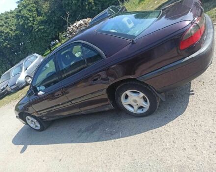 Червоний Опель Омега, об'ємом двигуна 2 л та пробігом 534 тис. км за 1200 $, фото 1 на Automoto.ua