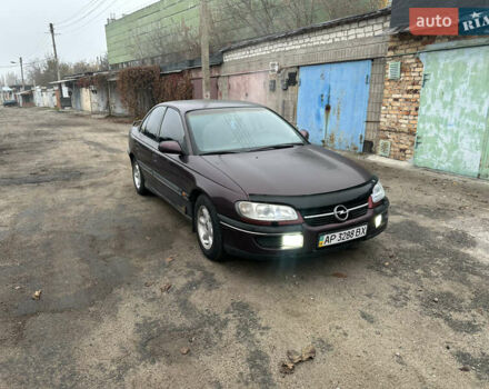 Красный Опель Омега, объемом двигателя 2.5 л и пробегом 390 тыс. км за 1800 $, фото 1 на Automoto.ua