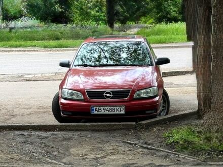 Опель Омега 1995 в Краматорске на Automoto.ua Красный Опель Омега, объемом двигателя 2.5 л и пробегом 436 тыс. км за 3500 $, фото 1 на Automoto.ua