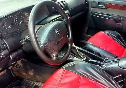 Красный Опель Омега, объемом двигателя 2 л и пробегом 300 тыс. км за 1500 $, фото 1 на Automoto.ua