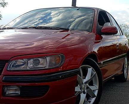 Красный Опель Омега, объемом двигателя 2.5 л и пробегом 360 тыс. км за 3300 $, фото 1 на Automoto.ua