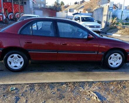 Красный Опель Омега, объемом двигателя 2 л и пробегом 270 тыс. км за 2400 $, фото 1 на Automoto.ua