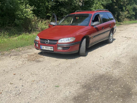 Красный Опель Омега, объемом двигателя 2.5 л и пробегом 200 тыс. км за 1800 $, фото 1 на Automoto.ua