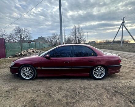 Красный Опель Омега, объемом двигателя 3 л и пробегом 100 тыс. км за 2600 $, фото 1 на Automoto.ua