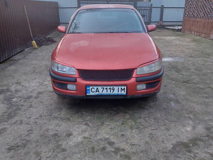 Красный Опель Омега, объемом двигателя 2 л и пробегом 240 тыс. км за 1200 $, фото 1 на Automoto.ua