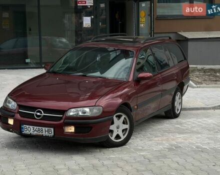Красный Опель Омега, объемом двигателя 2 л и пробегом 300 тыс. км за 1700 $, фото 1 на Automoto.ua