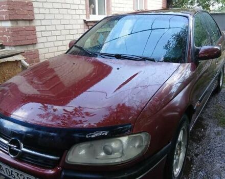 Червоний Опель Омега, об'ємом двигуна 2 л та пробігом 341 тис. км за 1800 $, фото 1 на Automoto.ua