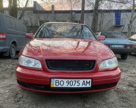 Красный Опель Омега, объемом двигателя 2.2 л и пробегом 320 тыс. км за 1900 $, фото 1 на Automoto.ua