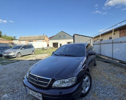 Красный Опель Омега, объемом двигателя 2.2 л и пробегом 222 тыс. км за 2550 $, фото 1 на Automoto.ua