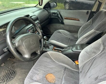 Серый Опель Омега, объемом двигателя 2.5 л и пробегом 300 тыс. км за 800 $, фото 5 на Automoto.ua