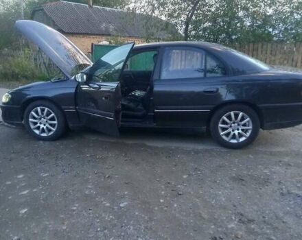 Сірий Опель Омега, об'ємом двигуна 2 л та пробігом 360 тис. км за 2300 $, фото 4 на Automoto.ua