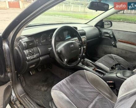 Сірий Опель Омега, об'ємом двигуна 2 л та пробігом 247 тис. км за 2200 $, фото 29 на Automoto.ua