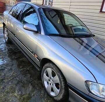 Серый Опель Омега, объемом двигателя 2 л и пробегом 400 тыс. км за 1900 $, фото 1 на Automoto.ua