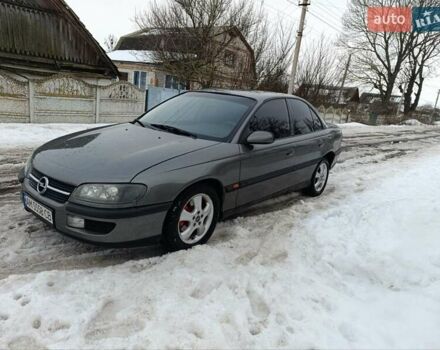 Серый Опель Омега, объемом двигателя 2 л и пробегом 240 тыс. км за 2600 $, фото 1 на Automoto.ua