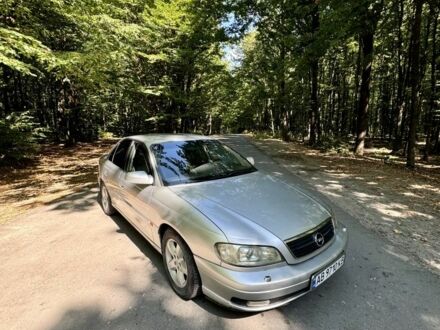 Серый Опель Омега, объемом двигателя 3 л и пробегом 320 тыс. км за 2100 $, фото 1 на Automoto.ua