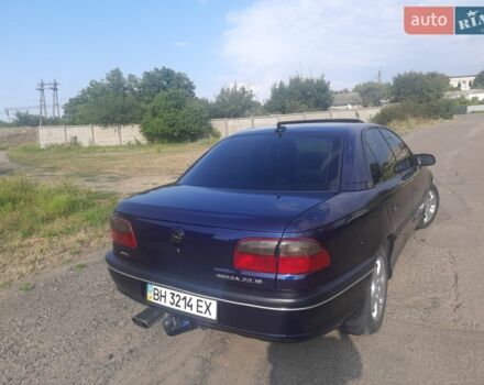 Синий Опель Омега, объемом двигателя 2 л и пробегом 305 тыс. км за 2600 $, фото 5 на Automoto.ua