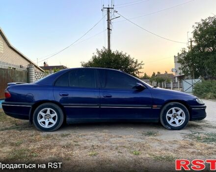 Синий Опель Омега, объемом двигателя 2.5 л и пробегом 293 тыс. км за 2800 $, фото 4 на Automoto.ua