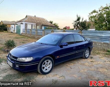 Синий Опель Омега, объемом двигателя 2.5 л и пробегом 293 тыс. км за 2800 $, фото 2 на Automoto.ua