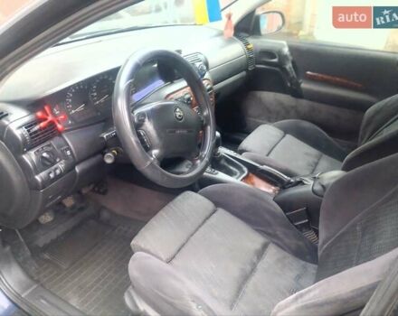 Синій Опель Омега, об'ємом двигуна 2 л та пробігом 294 тис. км за 2000 $, фото 20 на Automoto.ua