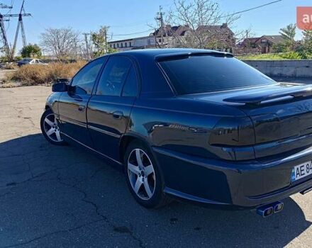 Синий Опель Омега, объемом двигателя 3 л и пробегом 350 тыс. км за 4500 $, фото 26 на Automoto.ua