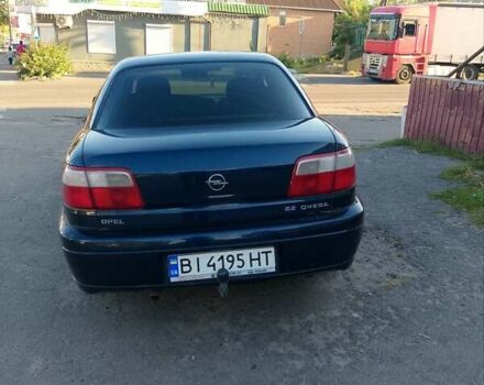 Синий Опель Омега, объемом двигателя 2.2 л и пробегом 290 тыс. км за 4000 $, фото 2 на Automoto.ua