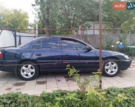 Синий Опель Омега, объемом двигателя 2.2 л и пробегом 290 тыс. км за 4000 $, фото 9 на Automoto.ua