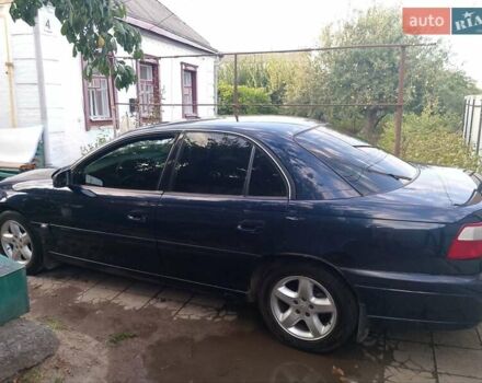 Синий Опель Омега, объемом двигателя 2.2 л и пробегом 290 тыс. км за 4000 $, фото 3 на Automoto.ua