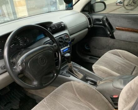 Синий Опель Омега, объемом двигателя 2.5 л и пробегом 205 тыс. км за 1650 $, фото 3 на Automoto.ua