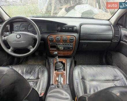 Синий Опель Омега, объемом двигателя 2.5 л и пробегом 400 тыс. км за 2400 $, фото 5 на Automoto.ua